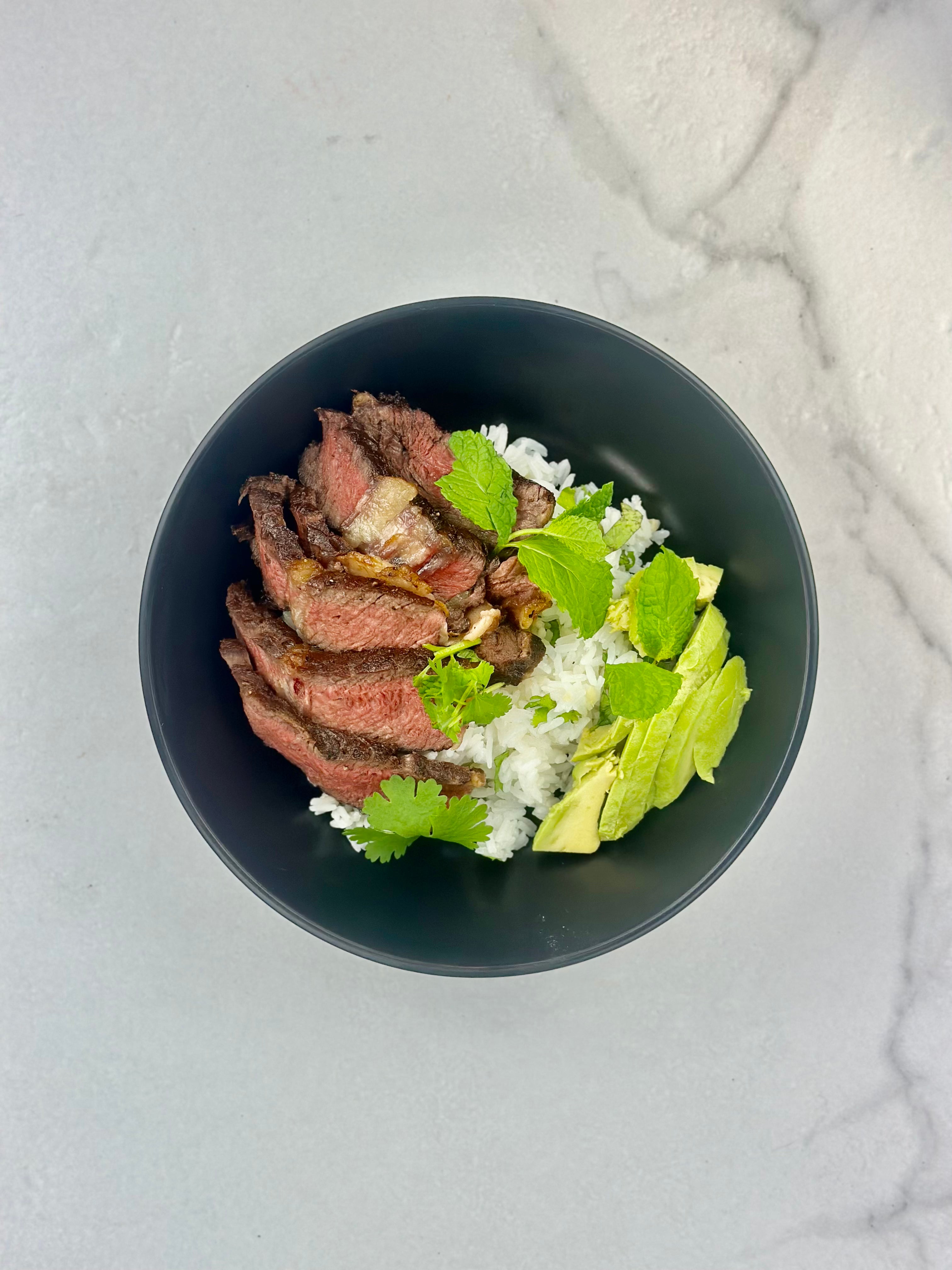 Herb, lemon & garlic steak on rice 