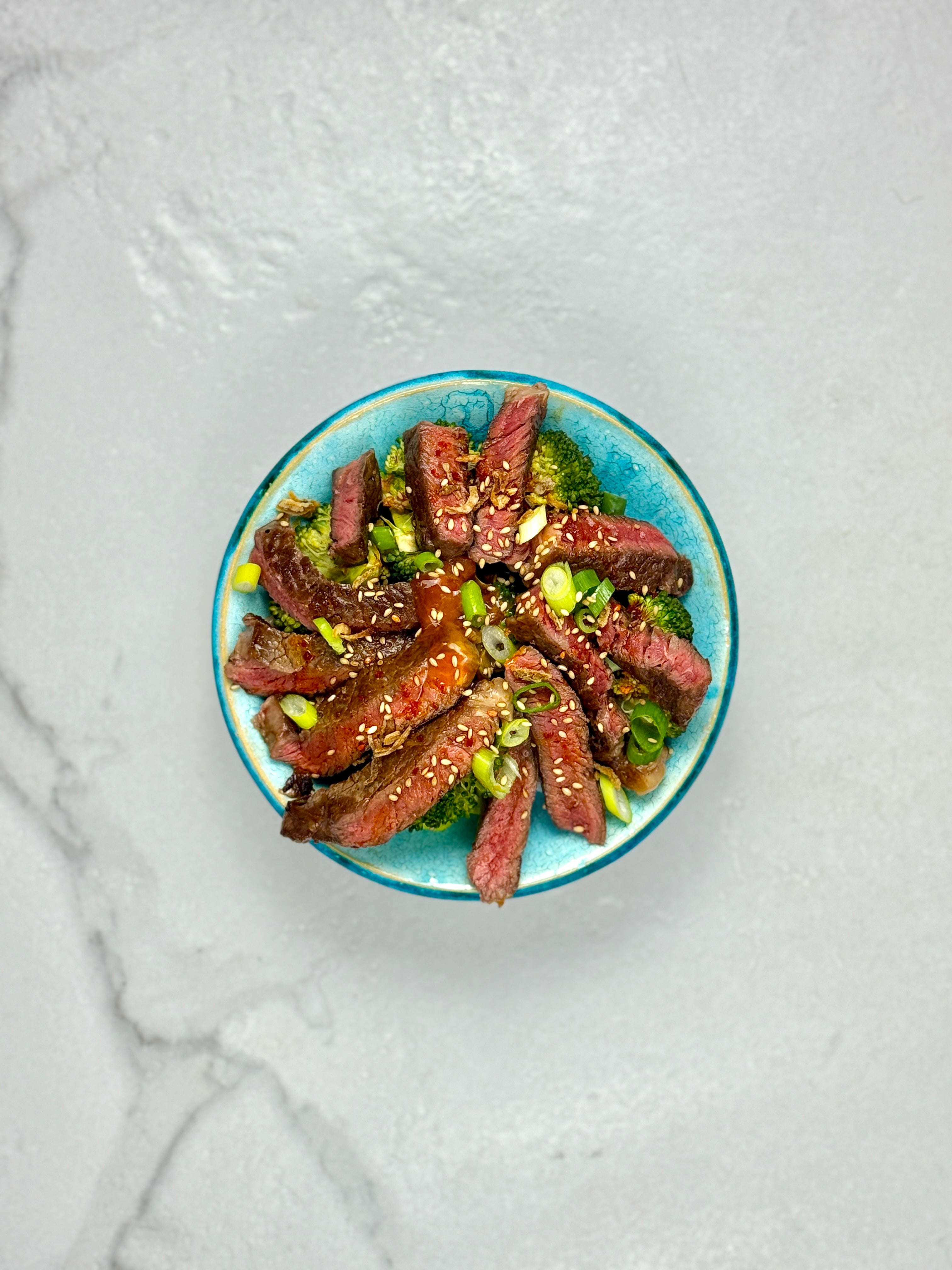 Steak over garlic rice w/ broccoli & beans
