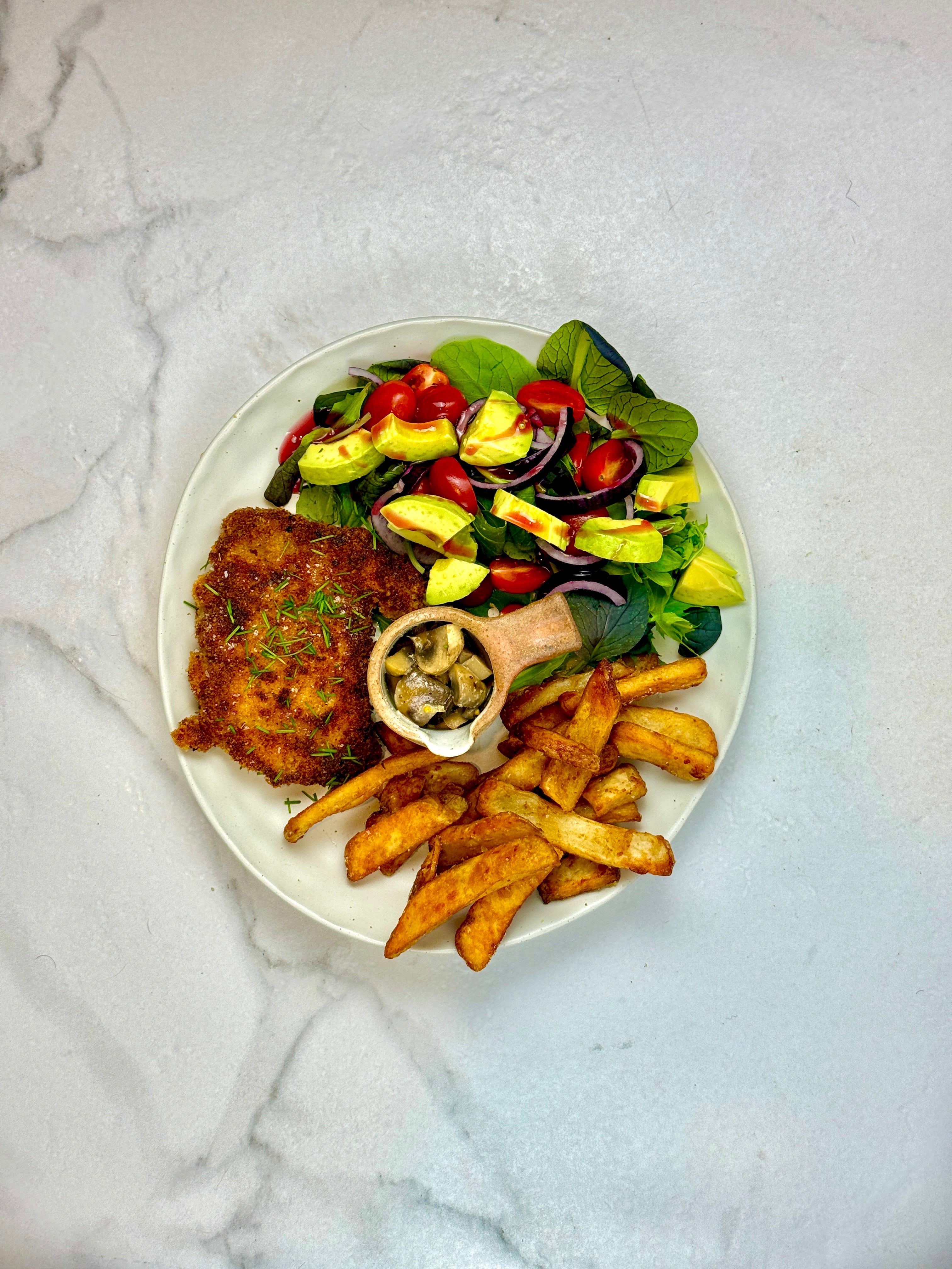 Chicken schnitty w/ mushroom sauce, fries & salad