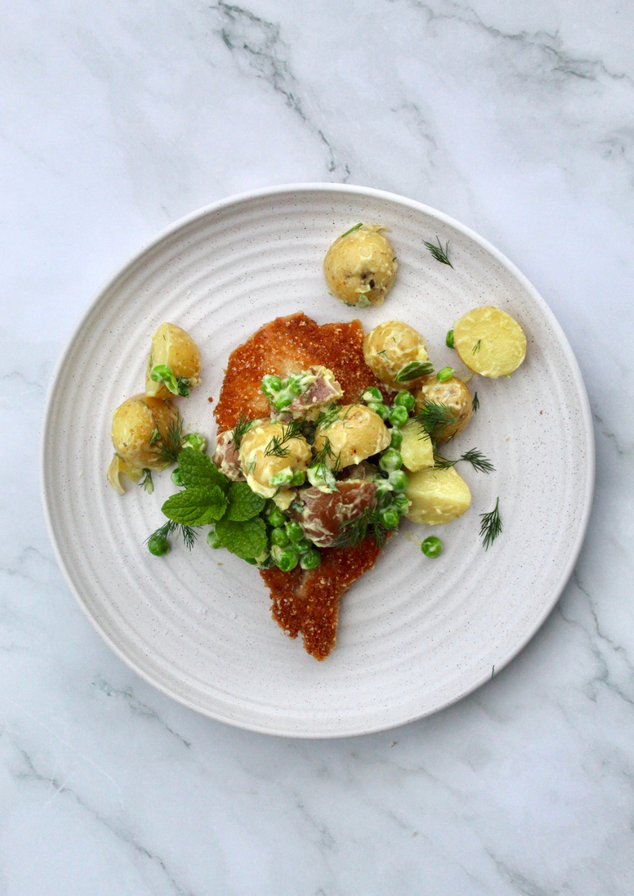 Pork schnitzel w/ potato & pea salad